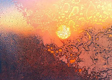 Nature background with ice pattern, bright sunlight and water drops on win... Stock Photos