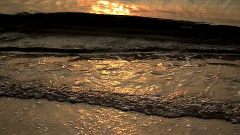 Nature background. Ocean beach waves on beach at sunset. Stock-Footage 76691678