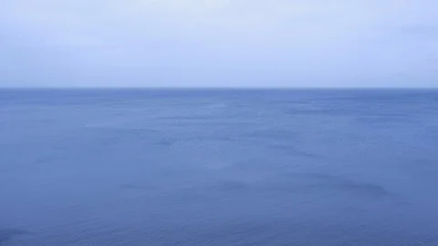 Nature background with sky and waves on blue sea surface coming from the shore. Stock Footage 116365055