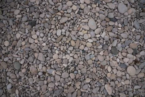 Nature background top view of grey and brown beach stones background Stock Photos