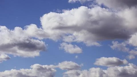 A nature background. white clouds over blue sky Stock Photos