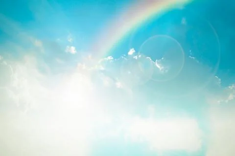 Nature cloudscape with blue sky and white cloud with rainbow Stock Photos