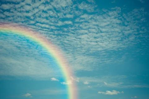 Nature cloudscape with blue sky and white cloud with rainbow Stock Photos