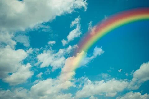 Nature cloudscape with blue sky and white cloud with rainbow Stock Photos