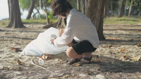 Nature conservation concept of 4k Resolution. Asian women collecting trash to Stock Footage 158059802