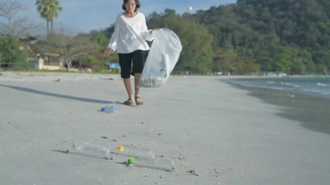 Nature conservation concept of 4k Resolution. Asian women collecting trash to Stock Footage 169605699