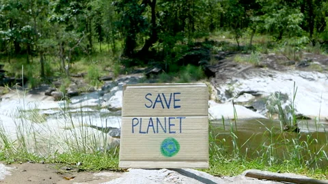 The nature conservation sign on stream flowing background.World Environment Day. Video stock 138907189