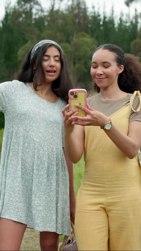Nature, direction and girl friends with phone on mobile app for navigation Stock Footage 333440853