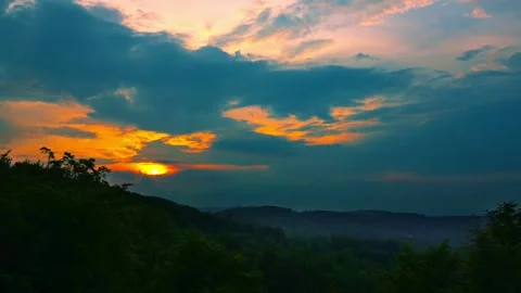 Nature landscape clouds rolling over mountains and hills on sunset time-lapse 스톡 동영상 242263964