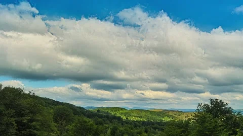 Nature landscape clouds rolling over hills and mountains time-lapse Stock Footage 311158778
