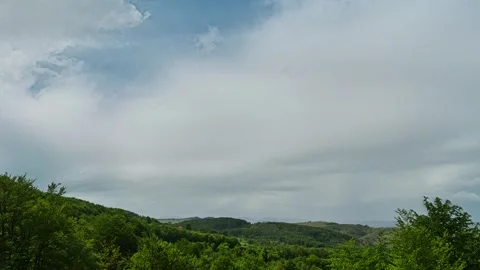 Nature landscape clouds rolling over hills and mountains time-lapse Stock Footage 311158920