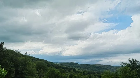 Nature landscape clouds rolling over hills and mountains time-lapse Stock Footage 312165765