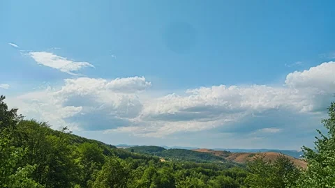 Nature landscape clouds rolling over hills and mountains time-lapse Stock Footage 312813299