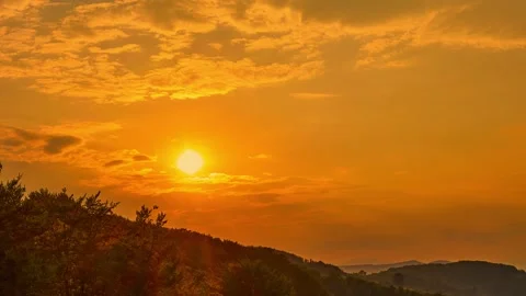 Nature landscape cumulus sunset clouds rolling over hills and mountains time-lap Stock-Footage 283634698