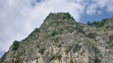 Nature Landscape - Looking Up a High Mountain Cliff - 29,97FPS NTSC Stock Footage 45862034