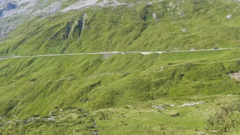 Nature. Mountain pass road with traffic, hiking path, summer alps Stock Footage 283267933