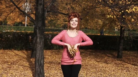 Nature outdoor playing relax leisure concept. Crazy girl throwing leaves Stock Footage