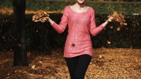 Nature outdoor playing relax leisure concept. Crazy girl throwing leaves Stock Footage