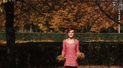 Nature outdoor playing relax leisure concept. Crazy girl throwing leaves Stock Footage