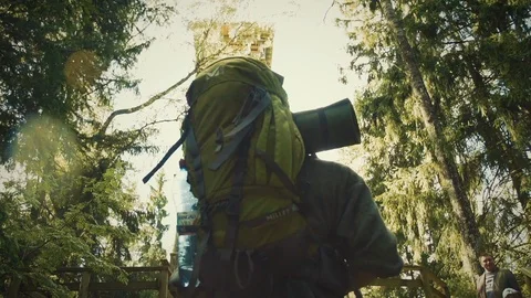 Nature Package 13 | back close up of hikers backpack while walking to tower Stock Footage 119155395