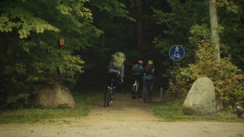 Nature Package 23 | backpackers cyclists cycling into the woods forest Stock Footage 119155931