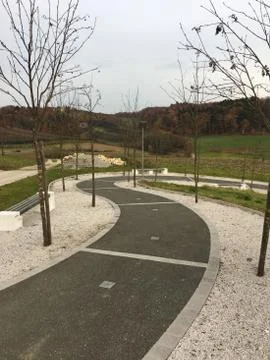Nature path with trees and benches Stock Photos