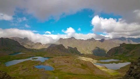 Nature time lapse video. Lakes on the top of hill and motion of the clouds. Stock Footage 285336284