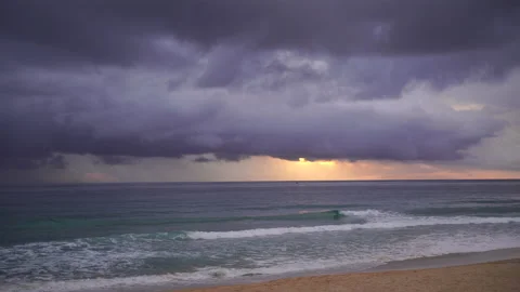 Nature video Mostly cloudy during the sunset. Rainstorms are falling into the Stock Footage 133350516