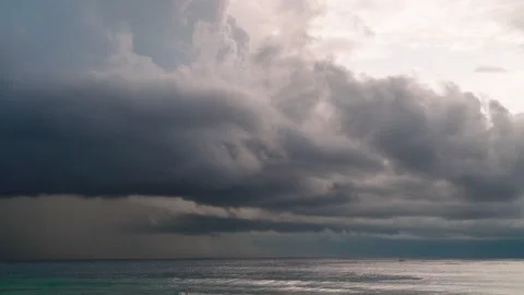 Nature video Mostly cloudy during the sunset. Rainstorms are falling into the Stock Footage 133351307