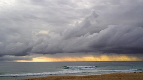 Nature video Mostly cloudy during the sunset. Rainstorms are falling into the Stock Footage 133351659