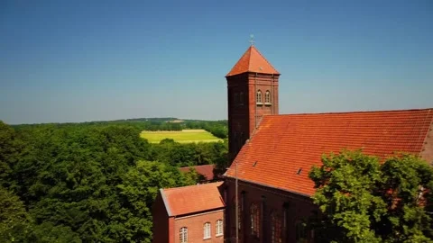 Nature view with church and  wind turbines and trees in summer Stock Footage 339782829