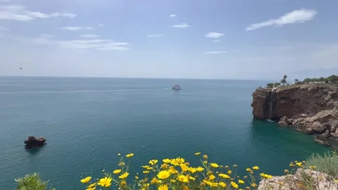 Nature view with a small waterfall falling to Mediterranean Sea Stock Footage 337113448