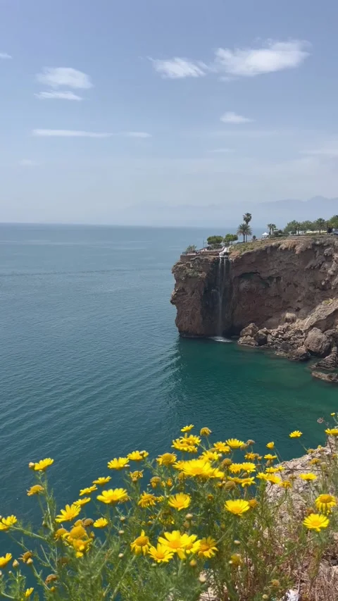 Nature view with a small waterfall falling to Mediterranean Sea Stock Footage 337113790