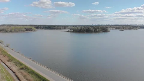 Nature views with lake, forest, field, clouds in a sunny day. Drone View. Video8 Stock Footage 131456924