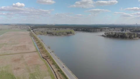 Nature views with lake, forest, field, clouds in a sunny day. Drone View. Video9 Stock Footage 131456935