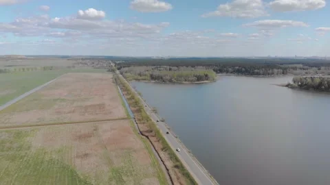 Nature views with lake, forest, field, clouds in a sunny day.Drone View. Video10 Stock Footage 131456936