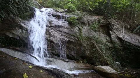 Nature waterfall in the mountain rock inside the forest Stock Footage 67755415