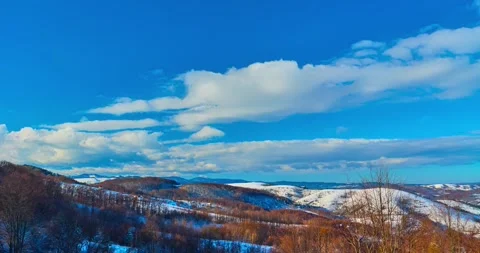 Nature winter landscape clouds rolling over hills and mountains time-lapse Stock-Footage 294971462