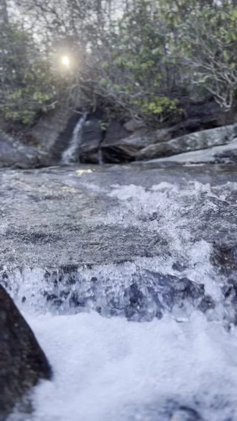 Nature’s Melody: Water Dancing Through Rocks Video stock 302837591