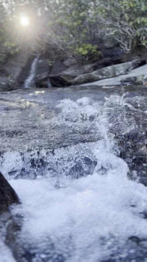 Nature’s Melody: Water Dancing Through Rocks Video stock 302837681