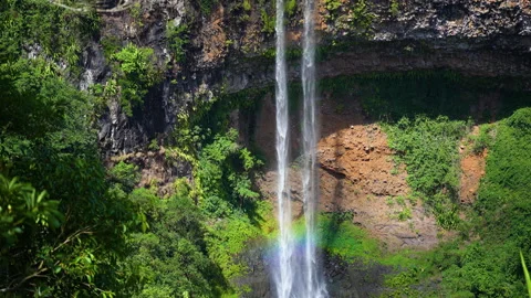 Nature's power: dramatic waterfall with rainbow in tropical setting. Stock Footage 304041308