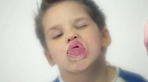 Naughty child making funny faces and having fun in slow motion Stock Footage 58875785