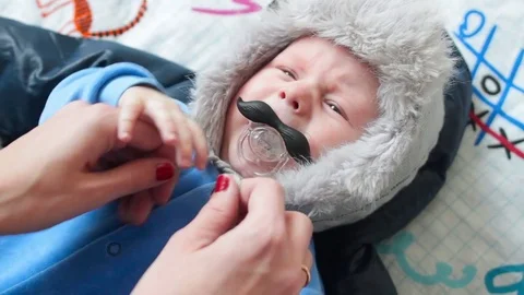 Naughy kid does not want to dress. Crying and screaming Stock Footage 71646311
