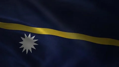 Nauru flag waving closeup with white star and yellow stripe on blue fabric, seam Stock Footage 339547777