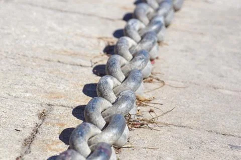 Nautical anchor chains on the pier Stock Photos
