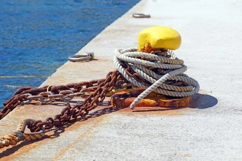 Nautical anchor chains on the pier Stock Photos