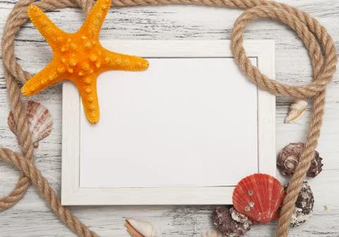 Nautical background with ropes, shells and starfish Stock Photos