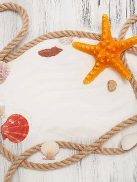 Nautical background with ropes, shells and starfish Stock Photos