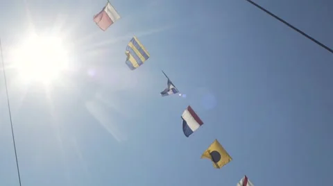 Nautical Flags Against Blue Sky Stock Footage 64413672