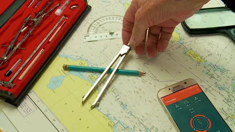 Nautical navigation instruments plotting a course Stock Footage 130558026